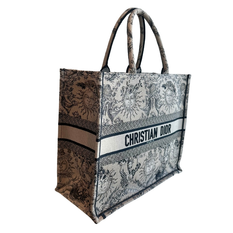 Christian Dior Book Tote
Brown Large Tote 
Brown and Black Canvas
Rolled Handles & Dual Shoulder Straps
Embroidered Accent
Open Top