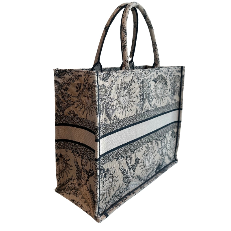 Christian Dior Book Tote
Brown Large Tote 
Brown and Black Canvas
Rolled Handles & Dual Shoulder Straps
Embroidered Accent
Open Top