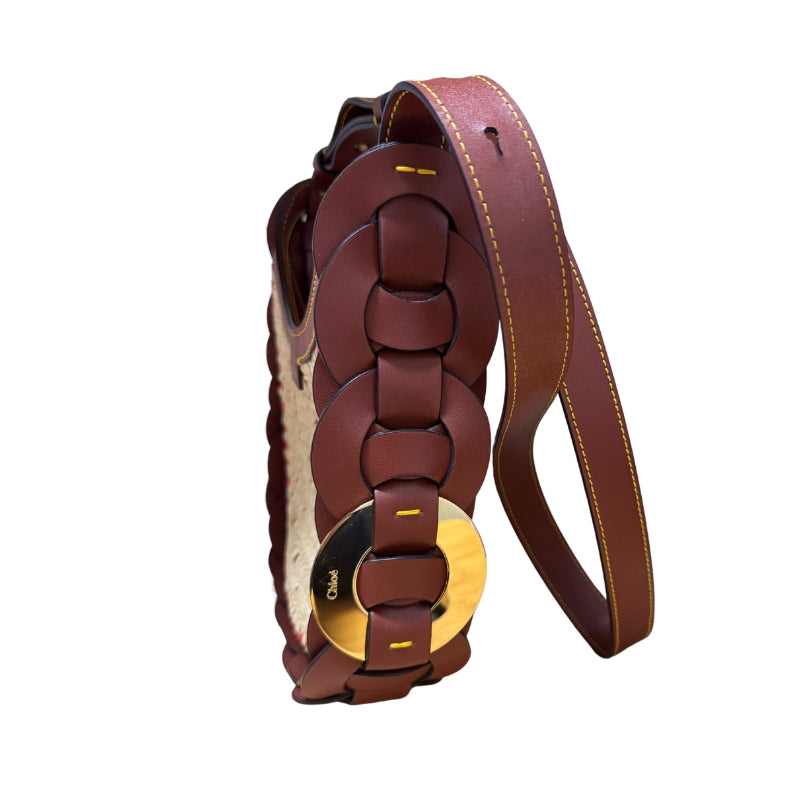 Chloe Raffia Darryl Hobo
Brown Calfskin Leather
Raffia
Looping Leather Shoulder Strap
Gold-Toned Ring
Beige Fabric Interior 