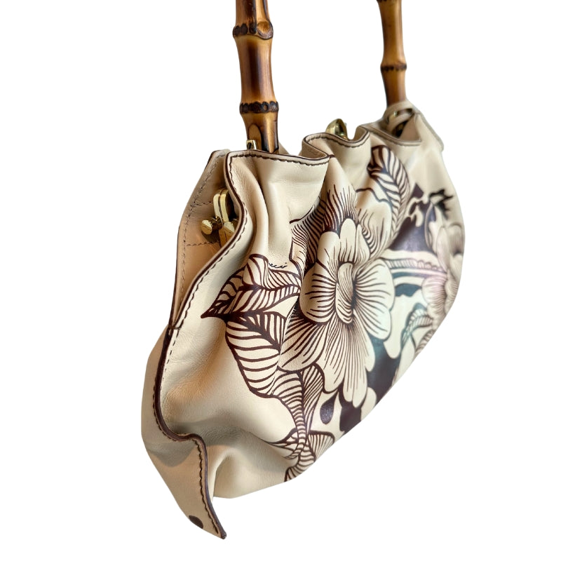 Gucci Floral Tattoo Bamboo Bag
Vintage
Neutrals Leather
Floral Print
Gold-Toned Hardware
Floral Print
Bamboo Handle
Push Lock Closure 