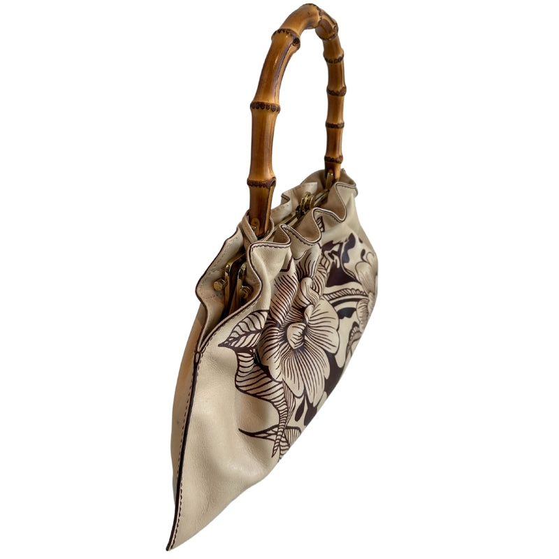 Gucci Floral Tattoo Bamboo Bag
Vintage
Neutrals Leather
Floral Print
Gold-Toned Hardware
Floral Print
Bamboo Handle
Push Lock Closure 