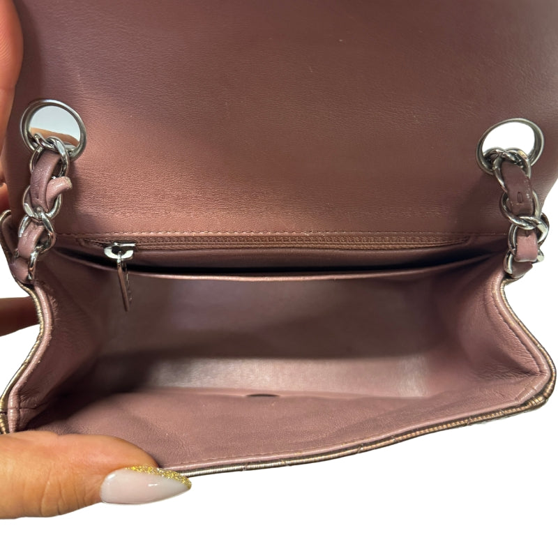 Chanel Patent Quilted Mini 
Diamond Quilted Patent Leather 
Bronze Color 
Vertical Stripes Pattern
Rear Pocket 
Long Silver Chain Link 
Front Flap
CC Lock Closure 
Matte Leather Interior 