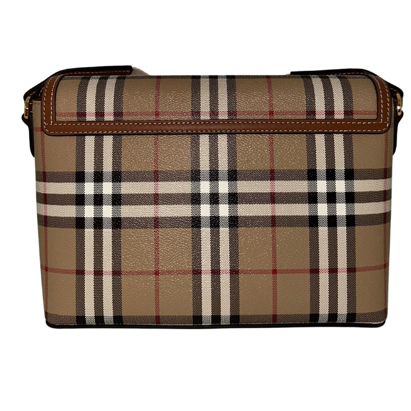 Burberry Note Bag   Textured Plaid Exterior  Brown Leather Features  Gold-Toned Hardware  White Canvas Strap   Magnetic Button Closure   Adjustable Strap 