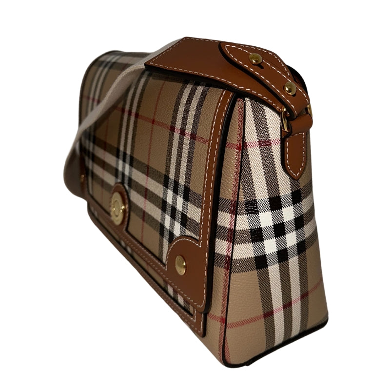 Burberry Note Bag   Textured Plaid Exterior  Brown Leather Features  Gold-Toned Hardware  White Canvas Strap   Magnetic Button Closure   Adjustable Strap 