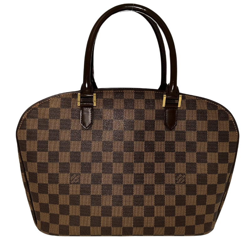 Louis Vuitton Damier Ebene Sarria Horizontal&nbsp;  Brown Coated Canvas  Damier Ebene Pattern  Gold-Toned Hardware  Leather Embellishments&nbsp;  Dual Rolled Handles  Suede Lining&nbsp;  Interior Pockets