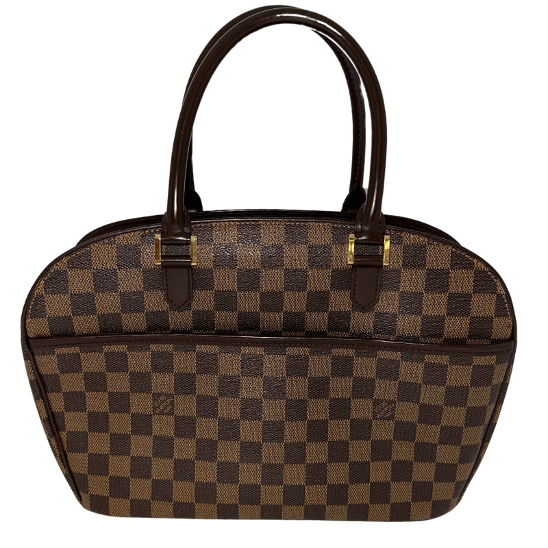 Louis Vuitton Damier Ebene Sarria Horizontal&nbsp;  Brown Coated Canvas  Damier Ebene Pattern  Gold-Toned Hardware  Leather Embellishments&nbsp;  Dual Rolled Handles  Suede Lining&nbsp;  Interior Pockets