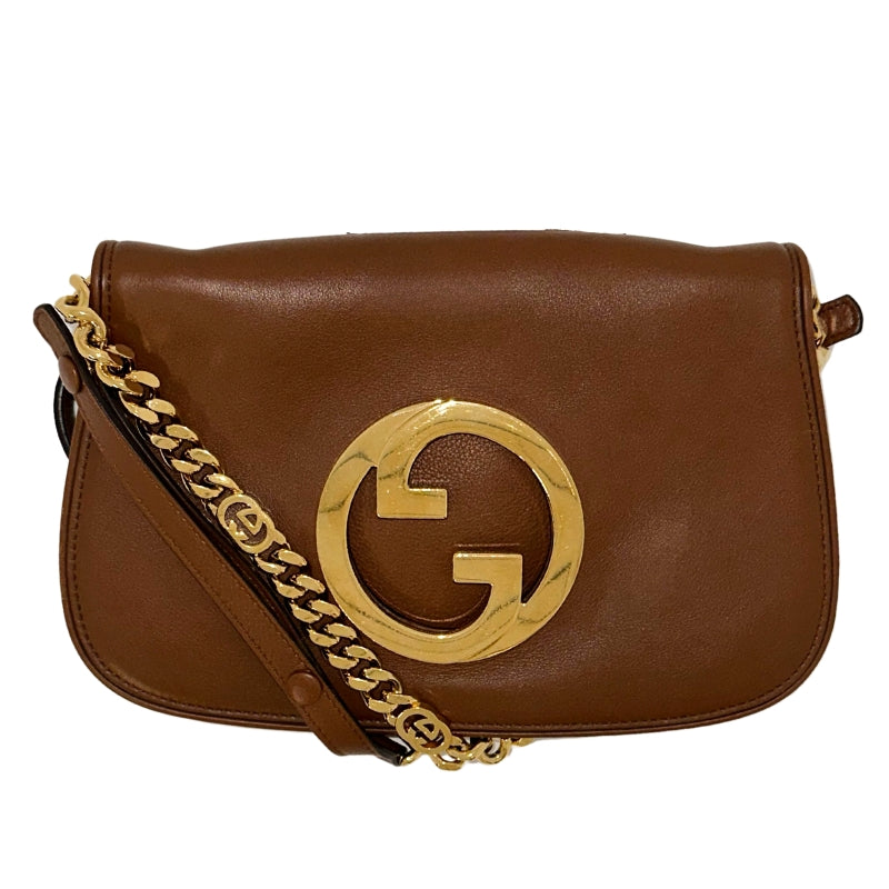 Gucci Blondie Shoulder Bag  Brown Leather&nbsp;  Gold-Toned Hardware  GG Gold-Toned Logo&nbsp;  Adjustable Shoulder Strap  Gold Chain Link Accents&nbsp;  Leather Interior Lining&nbsp;  Snap Closure at Front&nbsp;
