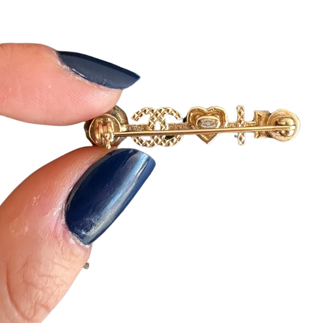 Chanel Pearl Heart Brooch 
Pearl 
Red Heart
Chanel CC Logo
Gold-Toned