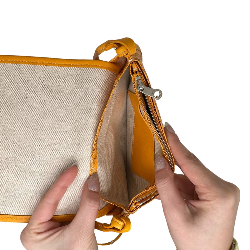 Goyard Plummet Clutch Yellow Printed   Goyardine   Silver-Toned Hardware  Single Shoulder Strap Single Exterior Pocket Canvas Lining Snap Closure at Front Zip Pocket in Interior Two Interior Card Pockets