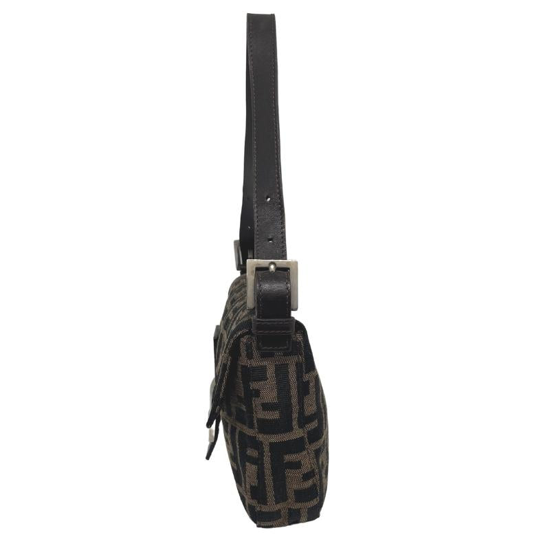 Fendi Zucca Baguette Bag, Brown Canvas Exterior, Zucca FF Logo, Silver Tone Hardware, Leather Trim, Single Shoulder Strap, Jacquard Lining, Single Interior Pocket, Snap Closure at Front, condition excellent