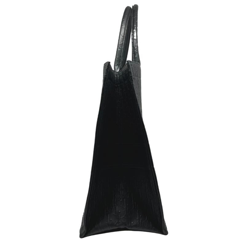 Dior leather oblique embossed book tote, black embossed dior logo exterior, christian dior across front, dual rolled handles, open top, suede lining, condition excellent, side view