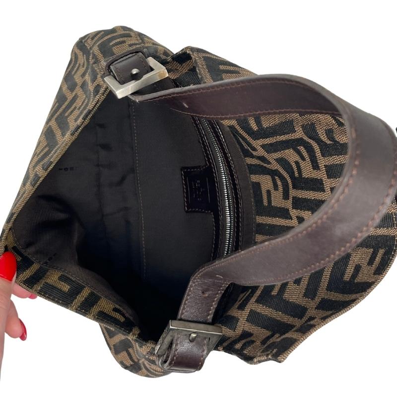 Fendi Zucca Baguette Bag, Brown Canvas Exterior, Zucca FF Logo, Silver Tone Hardware, Leather Trim, Single Shoulder Strap, Jacquard Lining, Single Interior Pocket, Snap Closure at Front, condition excellent