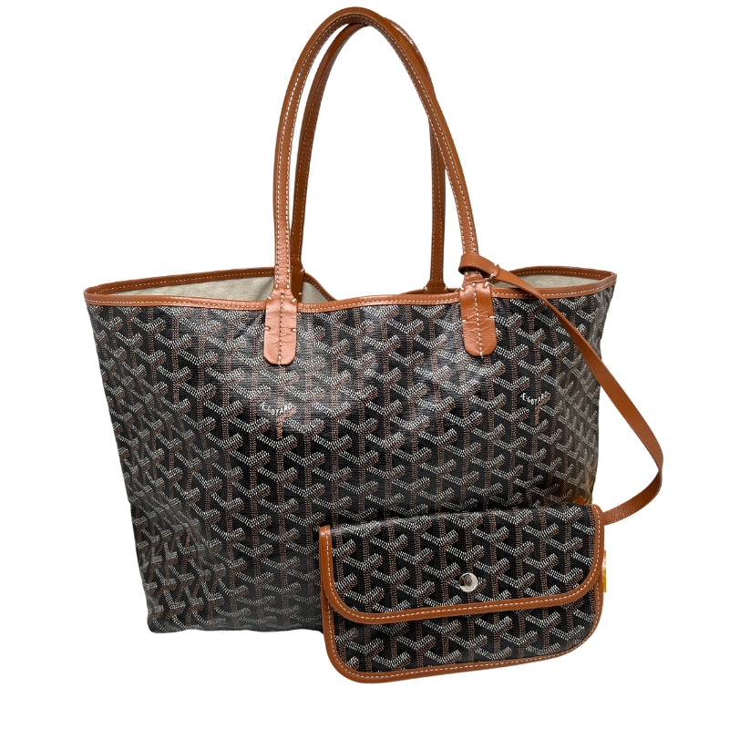 Front view: Coated Canvas. Tonal Leather Trim. Silver Hardware. Leather Shoulder Straps.