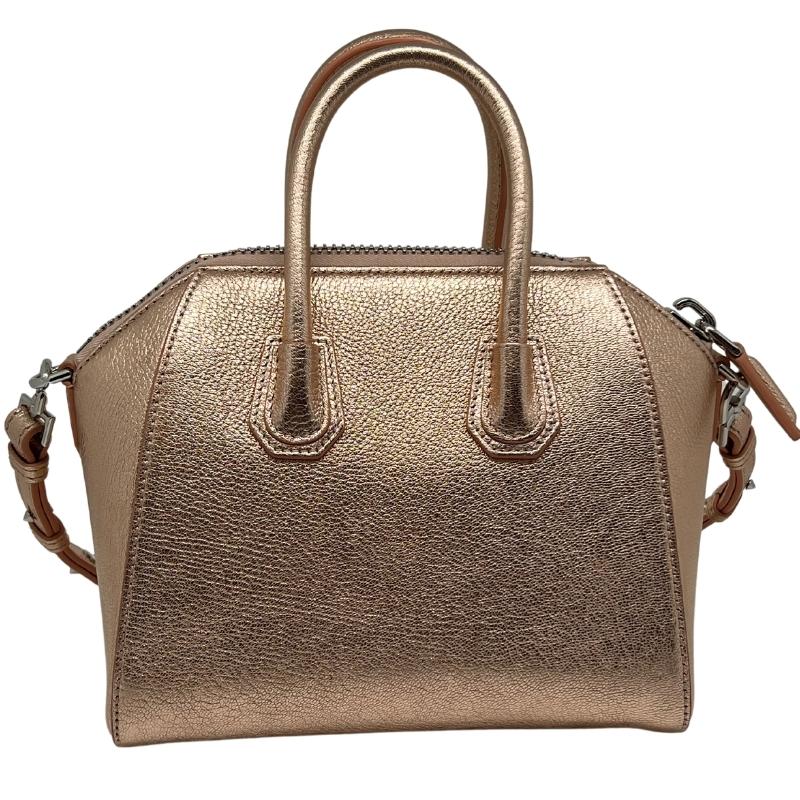 Givenchy Metallic Sugar Goatskin Mini Antigona Rose Gold, Goatskin Leather, Metallic Rose Gold, Rolled Leather Top Handles, Leather Shoulder Strap, Silver Hardware, Top Zipper, Fabric Interior, Zipper Pocket, condition excellent