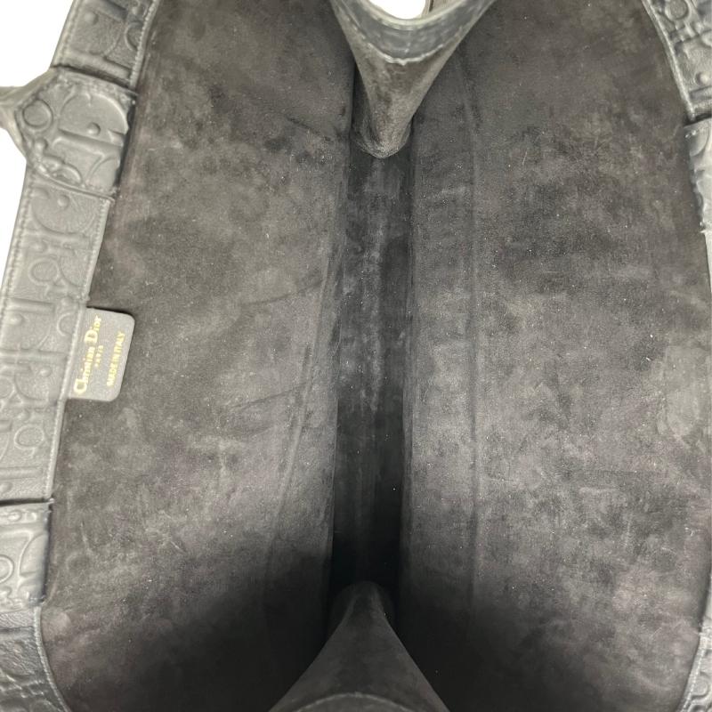 Dior leather oblique embossed book tote, black embossed dior logo exterior, christian dior across front, dual rolled handles, open top, suede lining, condition excellent, top view