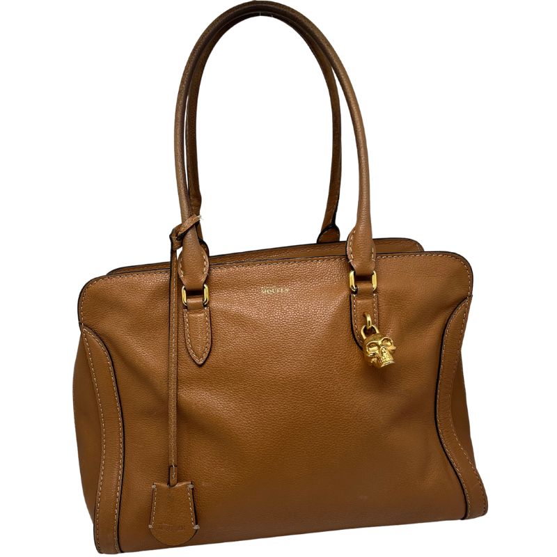 Alexander McQueen Leather Skull Padlock Tote with brown leather, gold skull accent, dual shoulder straps, dual zipper closure