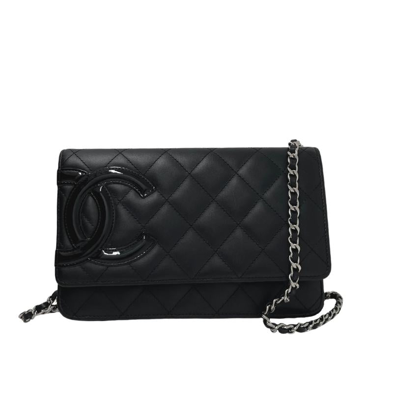 Chanel ligne cambon wallet on chain, quilted black leather exterior, patent CC logo detail, silver hardware, chain shoulder strap, snap closure at front, hot pink cc logo lining, dual interior pockets with card slots, condition excellent, front view