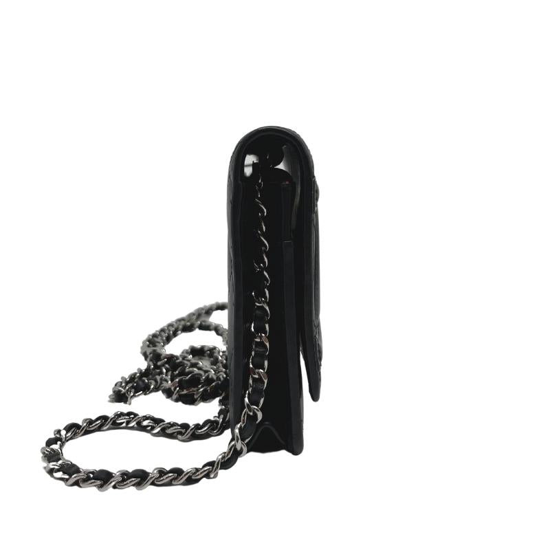 Chanel ligne cambon wallet on chain, quilted black leather exterior, patent CC logo detail, silver hardware, chain shoulder strap, snap closure at front, hot pink cc logo lining, dual interior pockets with card slots, condition excellent, side view
