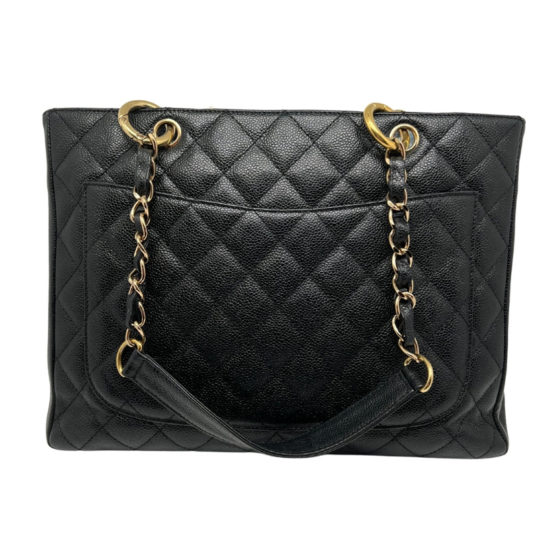 Back view: Quilted Caviar Leather in Black. Rear Patch Pocket. Threaded Gold Chain-Link Shoulder Straps.