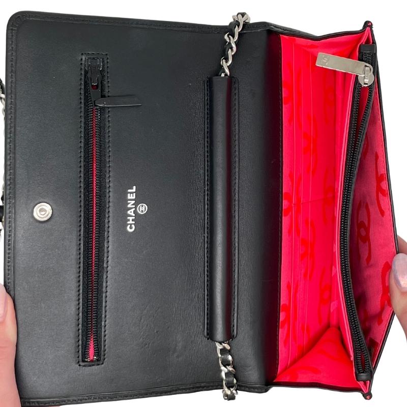 Chanel ligne cambon wallet on chain, quilted black leather exterior, patent CC logo detail, silver hardware, chain shoulder strap, snap closure at front, hot pink cc logo lining, dual interior pockets with card slots, condition excellent, top view