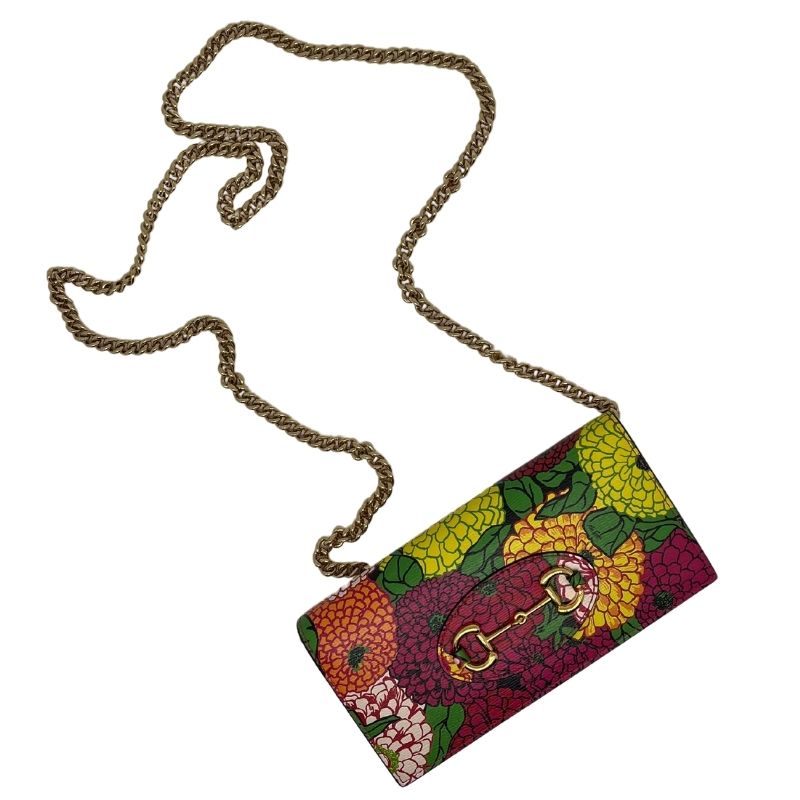 Gucci x Ken Scott Floral Wallet on Chain. Gold tone hardware with chain link strap and horsebit accent. New condition