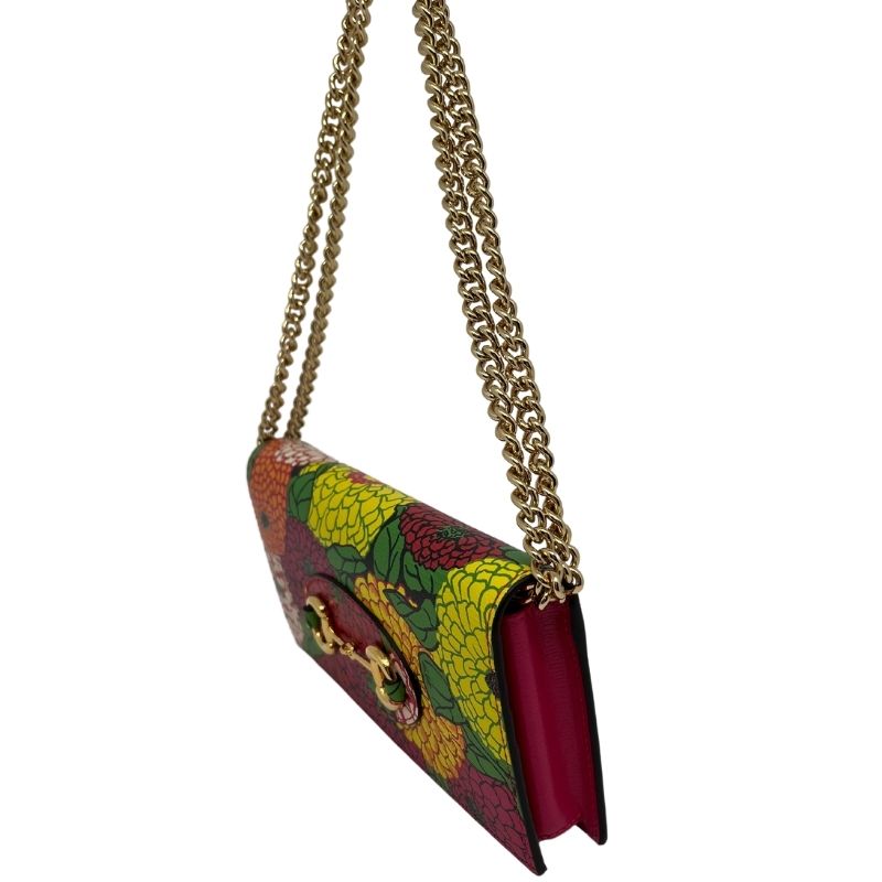 Gucci x Ken Scott Floral Wallet on Chain. Gold tone hardware with chain link strap and horsebit accent. New condition