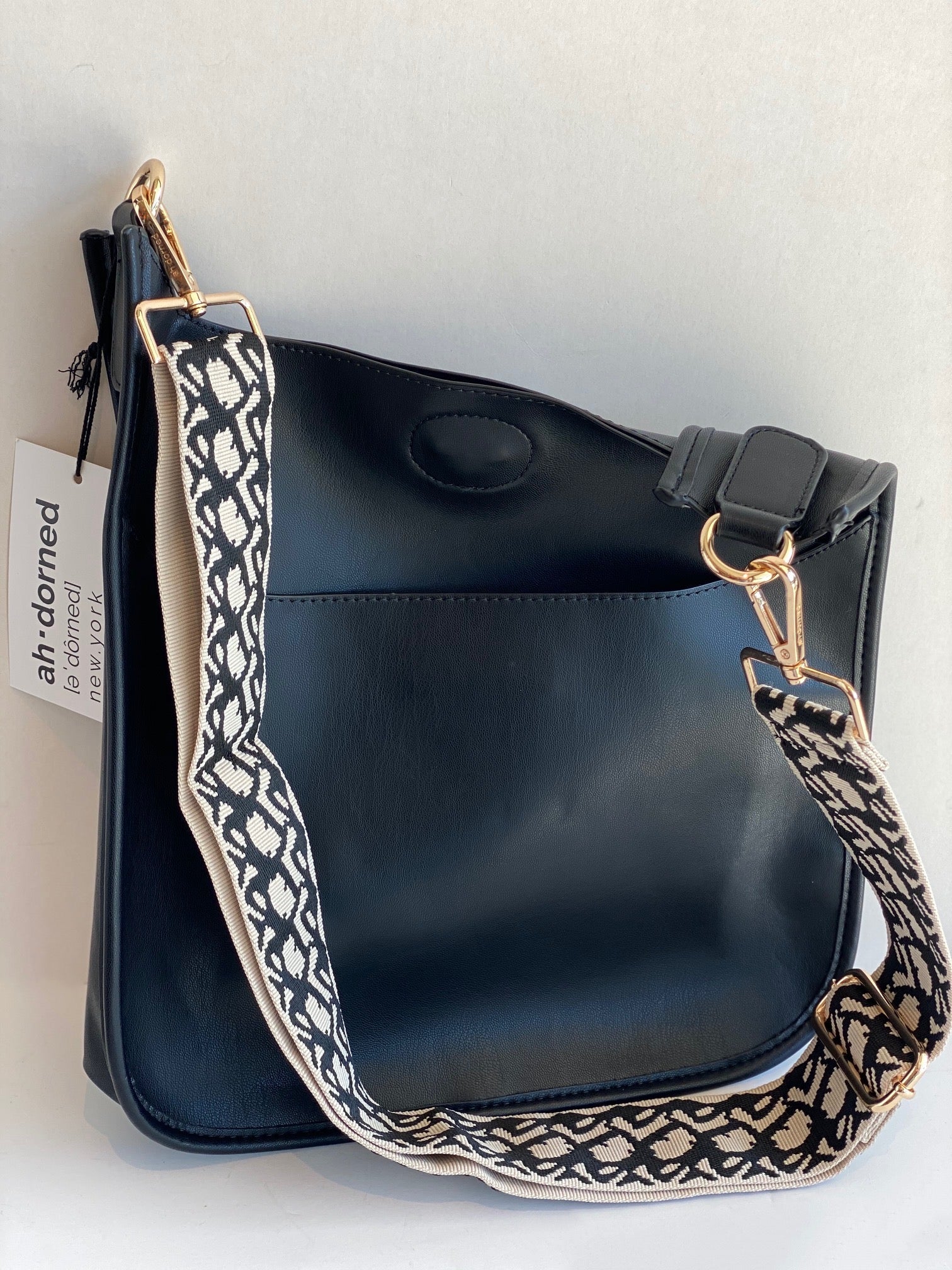 black ahdorned messenger bag