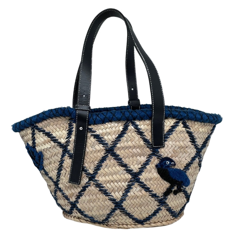 Loewe Embroidered Raffia Basket Tote   Tan Woven Raffia  Blue and Black Embroidery  Silver-Tone Hardware  Embossed Black Leather Loewe Patch   Adjustable Black Leather Straps   Unlined Interior