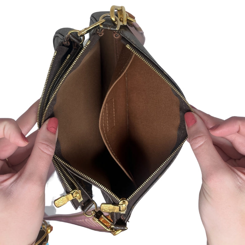 Louis Vuitton Multi Pochette Bag Monogram Canvas Exterior Brown Fabric Interior Detachable Front Pocket Zip Closure on Both Pockets Single Interior Flat Pocket Detachable Coin Purse with Cream Canvas Interior Gold Toned Hardware Pink Louis Vuitton Inscribed Cross Body Strap