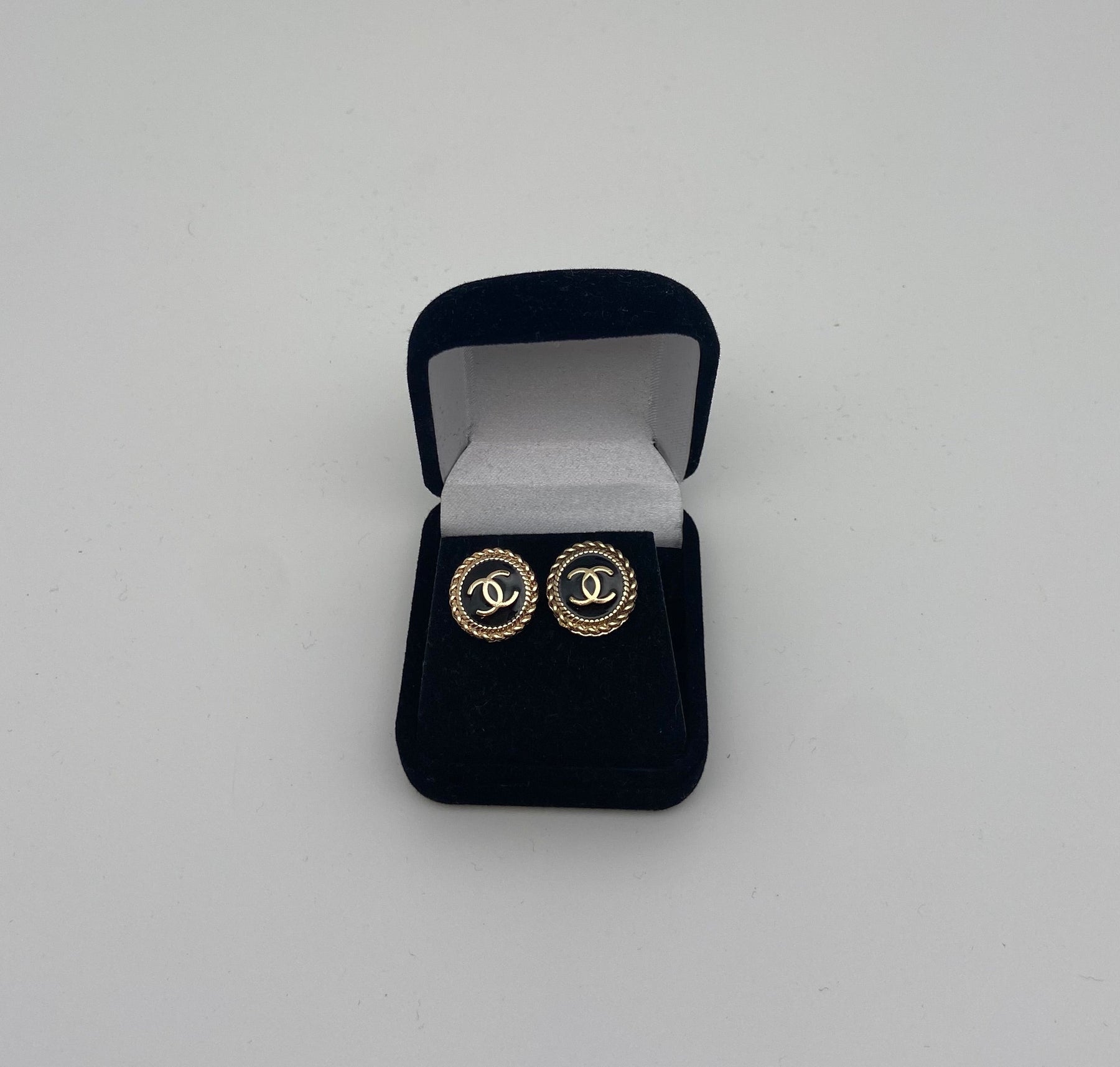 Black and gold Chanel button earrings
