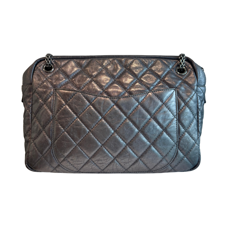 Back of Chanel Quilted Calfskin Leather Medium Reissue Camera Bag on a white background. 