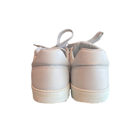 Back of Chanel White Leather Sneakers on a White Background. 