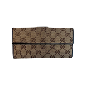 Back of Brown Gucci Canvas Icon Bar Monogram Flap Wallet on a White Background. 