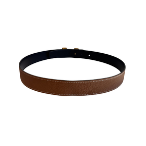 Back of Brown and Black Hermes H Buckle Reversible Belt on a White Background. 
