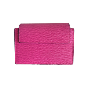 A bright pink textured leather wallet with a flap closure, shown against a plain white background.