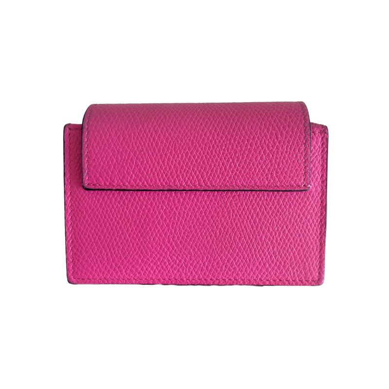 A bright pink textured leather wallet with a flap closure, shown against a plain white background.