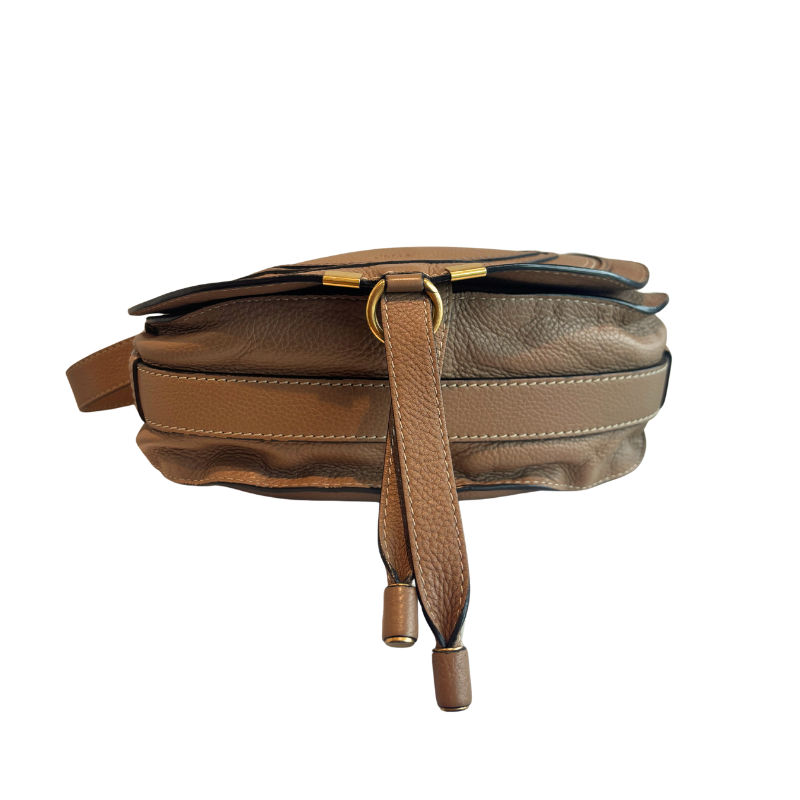A brown pebbled leather crossbody bag with a matching leather strap and gold-tone hardware, shown against a plain white background.