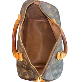 Bird's Eye View of Brown Louis Vuitton Monogram Speedy 30 Boston Bag on a White Background. 
