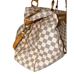 Louis Vuitton Damier Azur Evora GM  Neutral Coated Canvas&nbsp;  Gold-Toned Hardware&nbsp;  Leather Trim Embellishments&nbsp;  Flat Handles&nbsp;  Dual Shoulder Straps  Adjustable Shoulder Strap&nbsp;  Jacquard Lining&nbsp;  Single Interior Pocket&nbsp;  Zipper Closure at Top&nbsp;  Zipper Pocket on Exterior&nbsp;