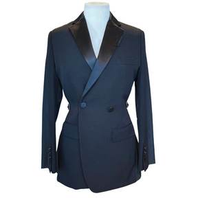 A black double-breasted blazer with satin black lapels, displayed on a mannequin torso against a plain white background.