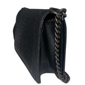 Chanel Black Boy Bag&nbsp;  Black Lambskin&nbsp;  Interlocking&nbsp;CC Logo  Chevron Pattern  Silver-Toned Accents&nbsp;  Chain Link Strap Accent  Push Lock Closure at Front&nbsp;  Grosgrain Lining Interior&nbsp;  Interior Pocket&nbsp;  Condition: Great, minor scratches on inside flap&nbsp;