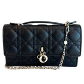 Christian Dior Top Handle&nbsp;

Black Lambskin&nbsp;

Silver-Toned Hardware&nbsp;

Pearls on Chain

Leather Handle

D.I.O.R Charms&nbsp;

Flap Closure&nbsp;