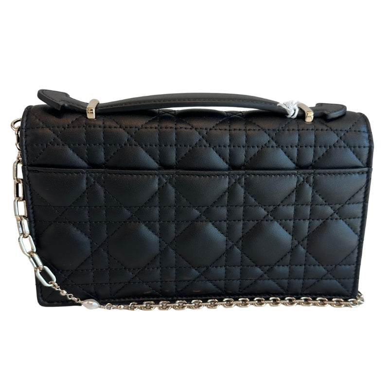 Christian Dior Top Handle&nbsp;

Black Lambskin&nbsp;

Silver-Toned Hardware&nbsp;

Pearls on Chain

Leather Handle

D.I.O.R Charms&nbsp;

Flap Closure&nbsp;