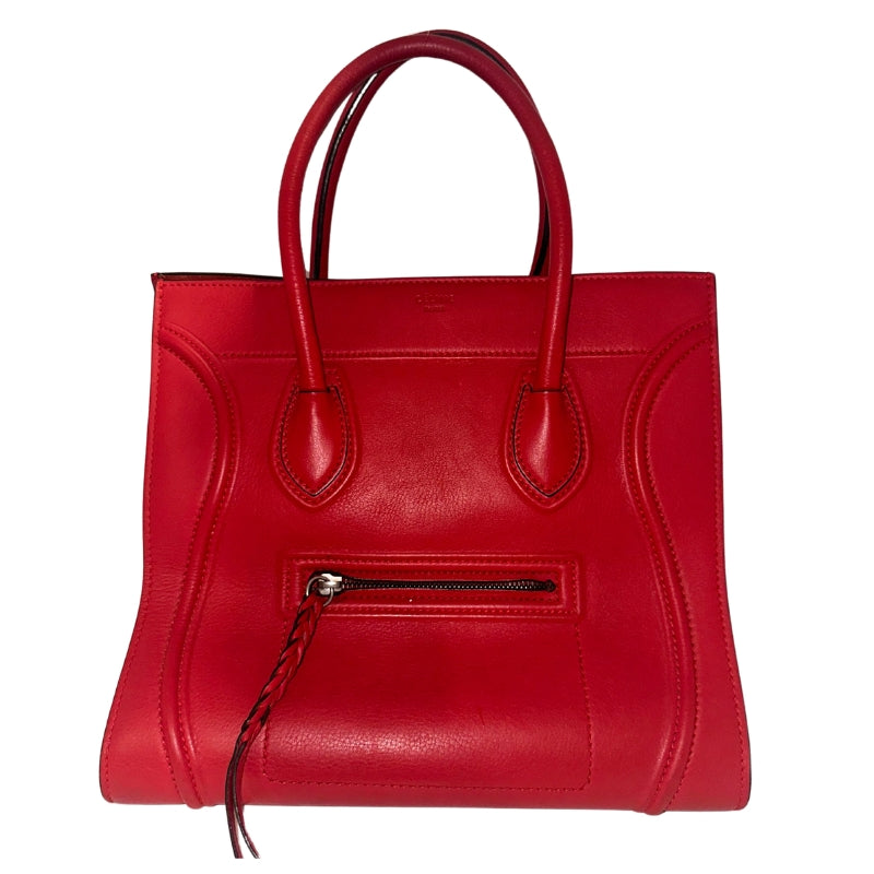 Celine Phantom Bag&nbsp;  Red Leather&nbsp;  Dual Rolled Handles  Braided Accents&nbsp;  Single Interior Pocket&nbsp;  Suede Red Lining Interior&nbsp;  Pull Through Closure at Top  Single Exterior Pocket&nbsp;