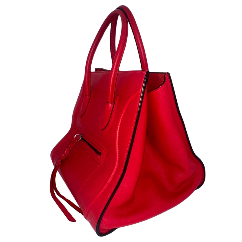 Celine Phantom Bag&nbsp;  Red Leather&nbsp;  Dual Rolled Handles  Braided Accents&nbsp;  Single Interior Pocket&nbsp;  Suede Red Lining Interior&nbsp;  Pull Through Closure at Top  Single Exterior Pocket&nbsp;