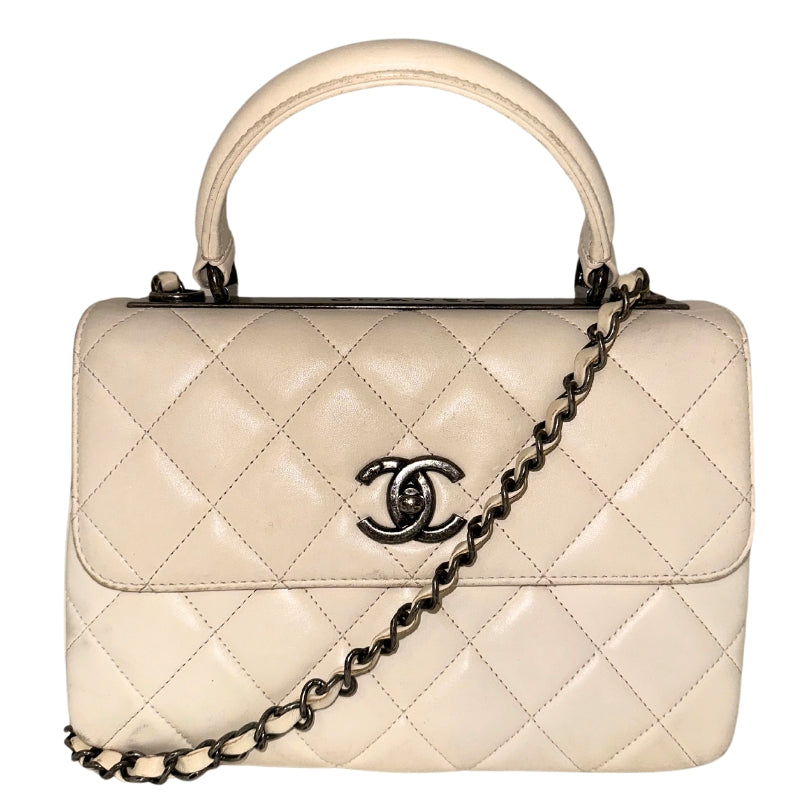 Chanel CC Flap Shoulder Bag&nbsp;  Neutral Leather&nbsp;  Interlocking CC Logo&nbsp;  Quilted Pattern&nbsp;  Antiqued Silver-Toned Hardware  Chain Link Shoulder Strap&nbsp;  Chain Link Accents&nbsp;  Single Interior Pocket&nbsp;  Leather Lining&nbsp;  Turn Lock Closure&nbsp;