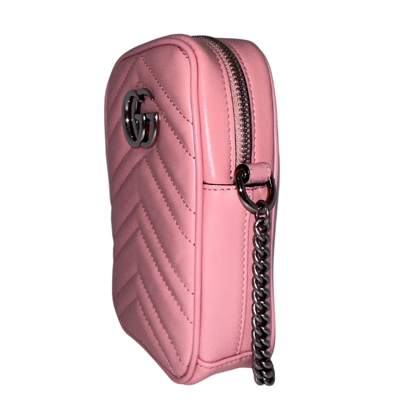 Gucci Marmont Mini&nbsp;  Gucci Crossbody Bag  Pink Leather&nbsp;  Double G Logo  Silver-Toned Hardware  Chain-Linked Shoulder Strap  Chain-Link Accents  Suede Interior&nbsp;  Card Slots in Interior&nbsp;  Zip Closure&nbsp;