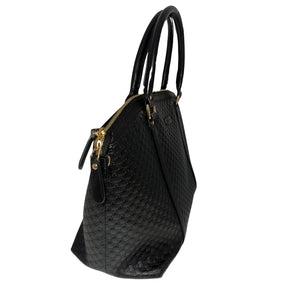 Gucci Microguccissima Dome Satchel&nbsp;  Micro Guccissima Black Leather&nbsp;  Dual Rolled Handles&nbsp;  Detachable Shoulder Straps  Beige Fabric Interior&nbsp;  Zipper Pocket in Interior&nbsp;  Patch Pockets in Interior&nbsp;  Gold-Toned Hardware&nbsp;  Top Zipper Closure&nbsp;