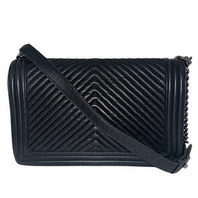 Chanel Black Boy Bag&nbsp; Black Lambskin&nbsp; Interlocking&nbsp;CC Logo Chevron Pattern Silver-Toned Accents&nbsp; Chain Link Strap Accent Push Lock Closure at Front&nbsp; Grosgrain Lining Interior&nbsp; Interior Pocket&nbsp; Condition: Great, minor scratches on inside flap&nbsp;