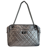 Front of Chanel Quilted Calfskin Leather Medium Reissue Camera Bag on a white background. 